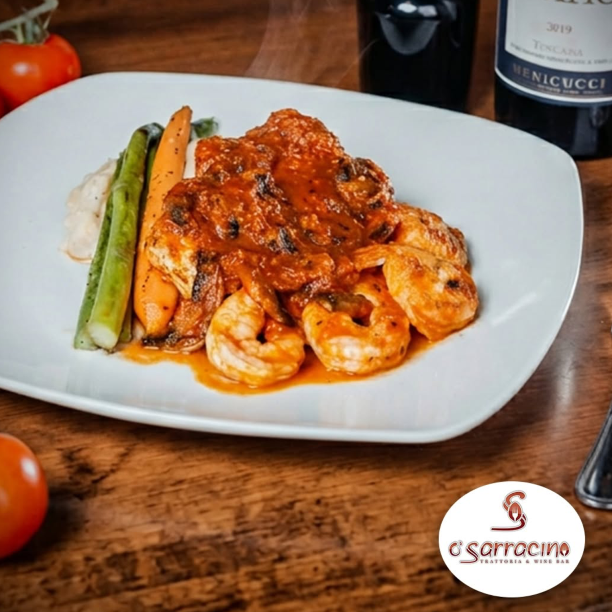 White dinner plate with cooked shrimp and vegetables