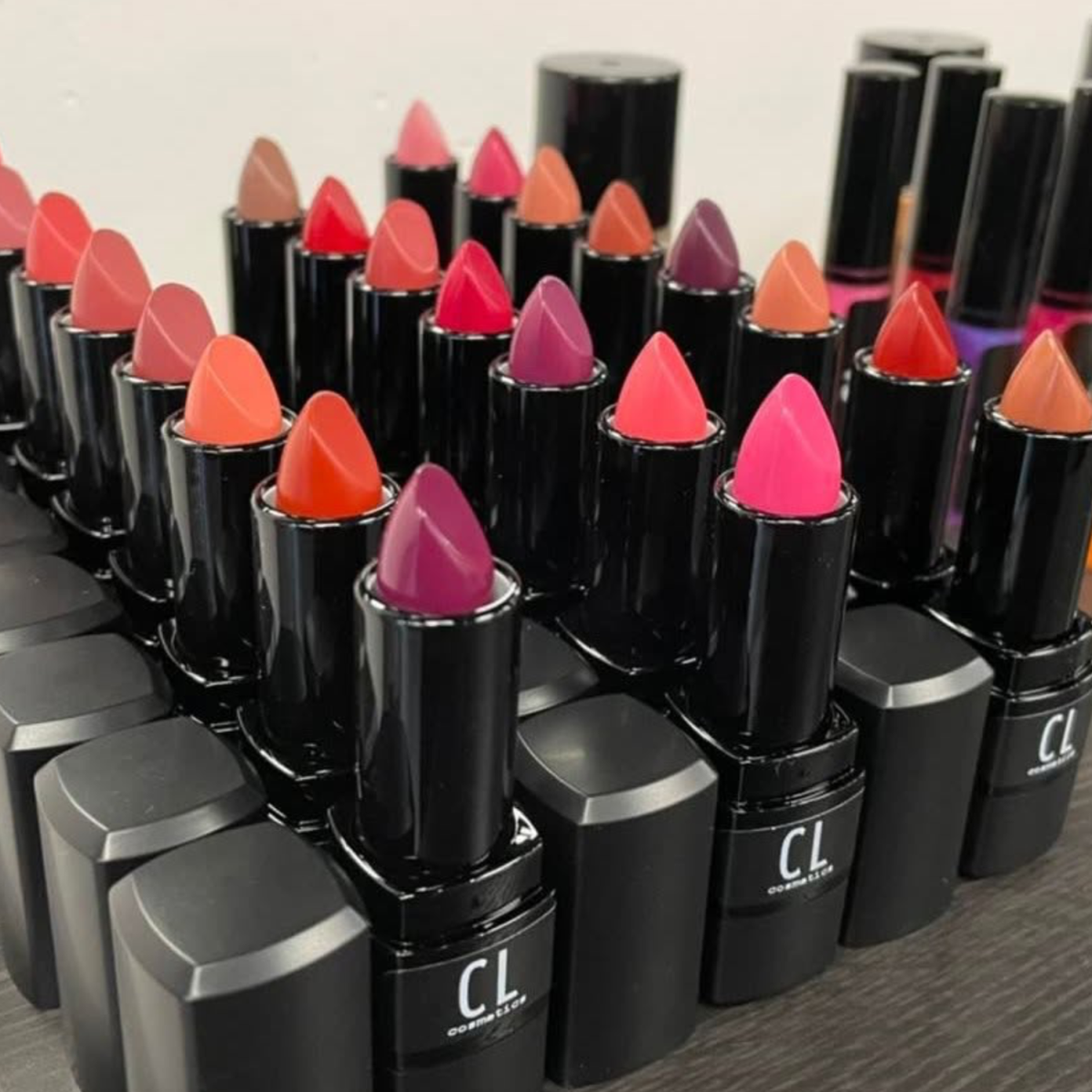 Varies shades of lipstick lined up in a row