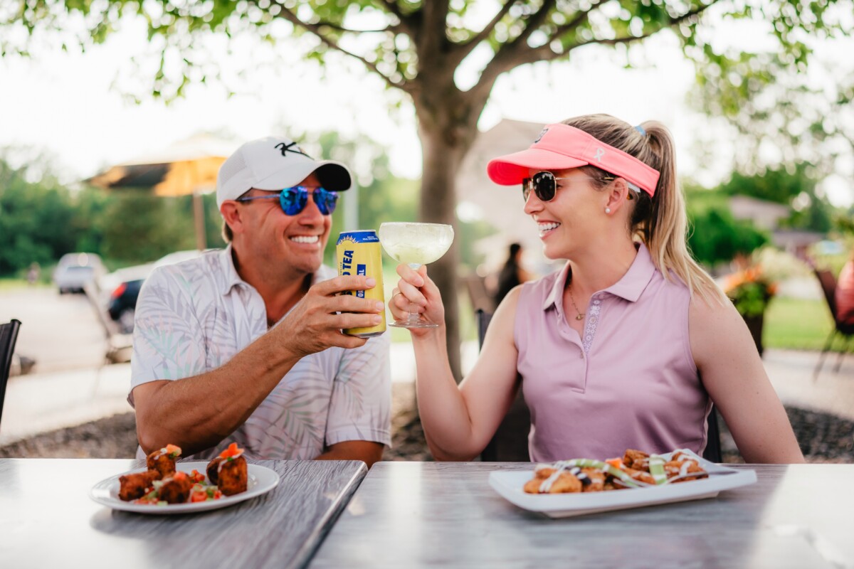 Golfers enjoy a meal after a loin