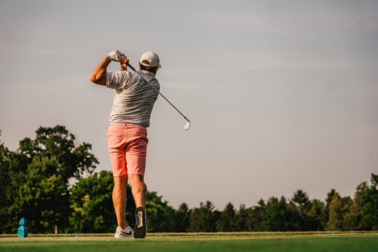 Golfer swings