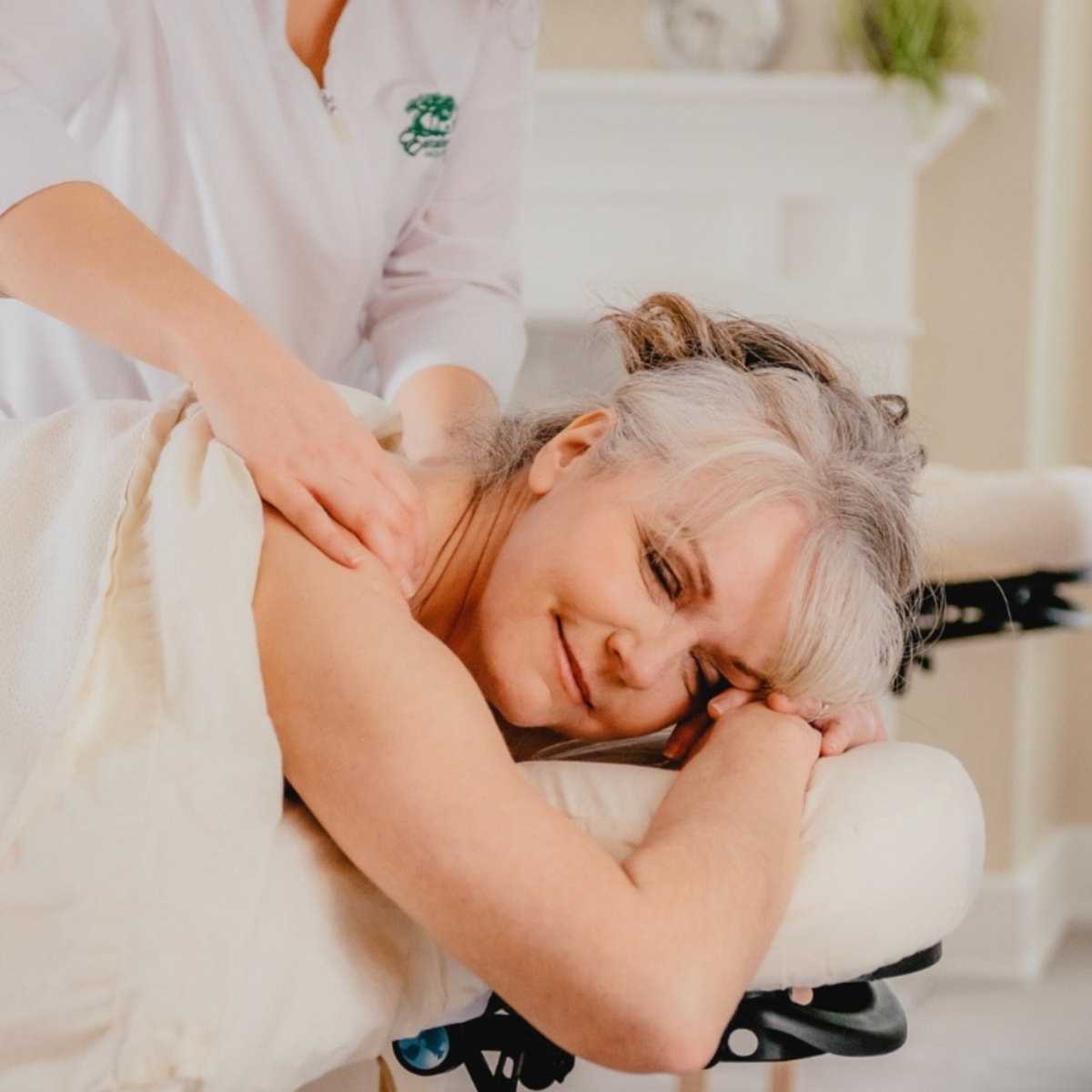 Smiling woman receiving a massage