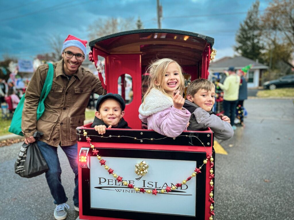 Parade goers are dressed festively ready for the parade to begin.