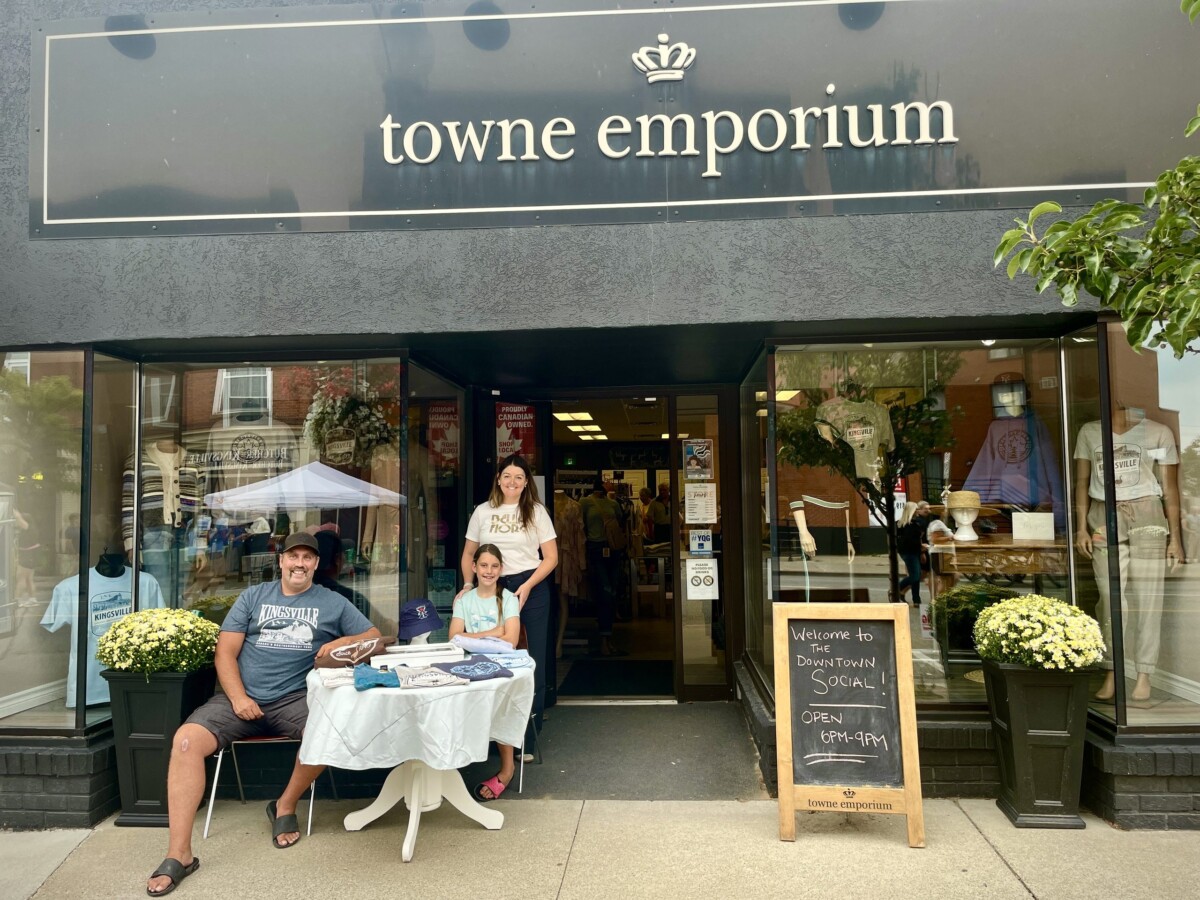 Small business owners outside of their storefront